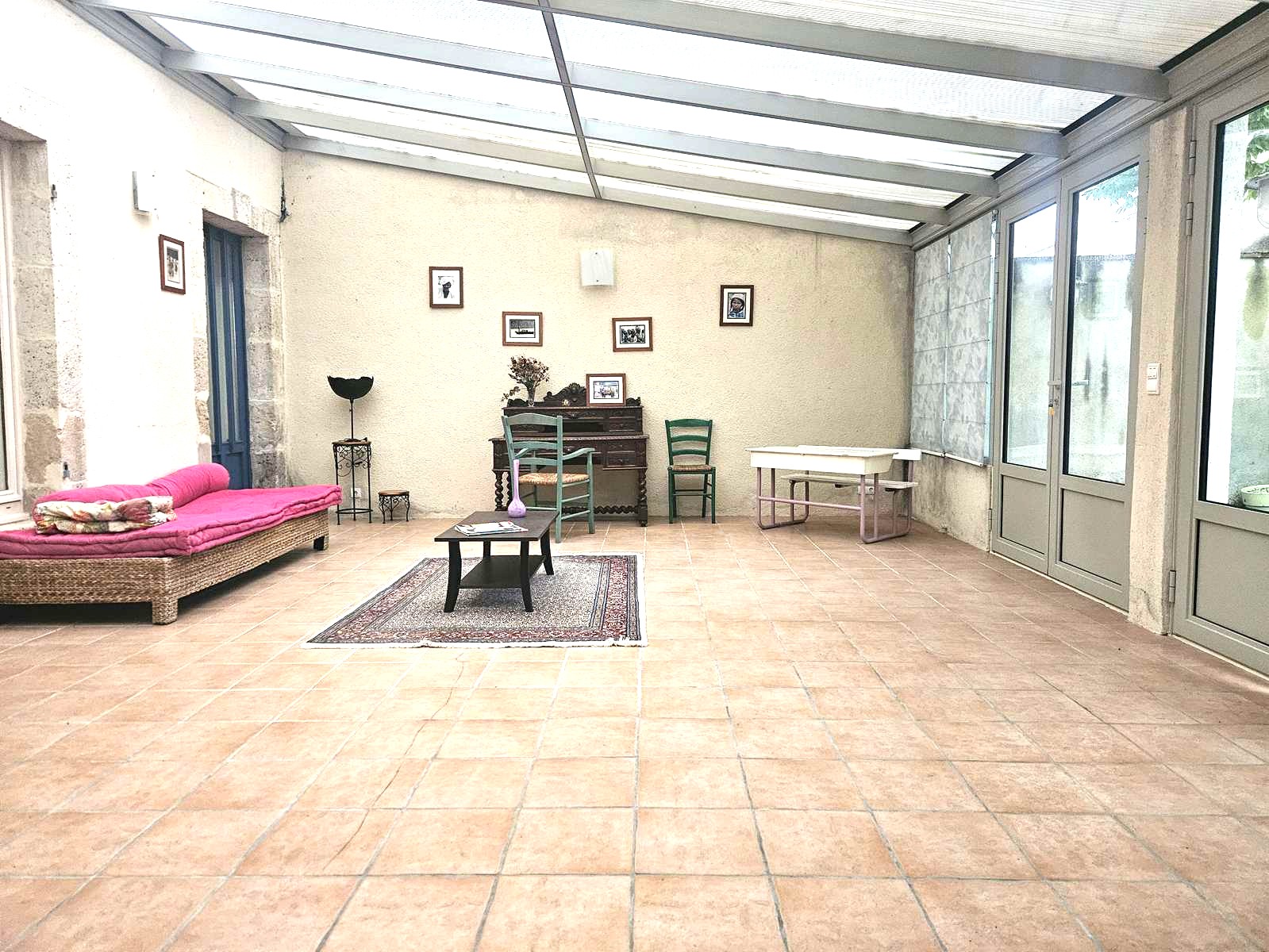 veranda-salon-interieur-maison-ville-Nerac-avec-jardin-AMGH-IMMOBILIER